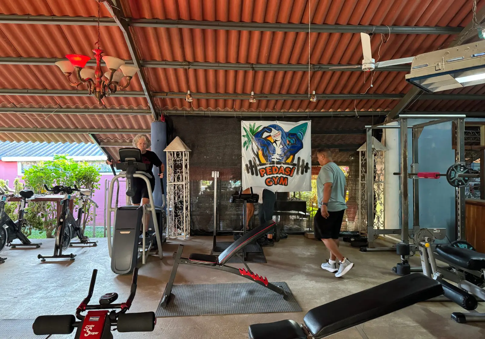 People exercising in an open-air gym.